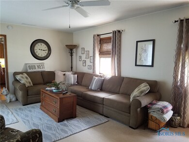 Large Bright Family Room with beautiful fireplace.
Sliding glass doors across from couch open to beautiful backyard oasis.