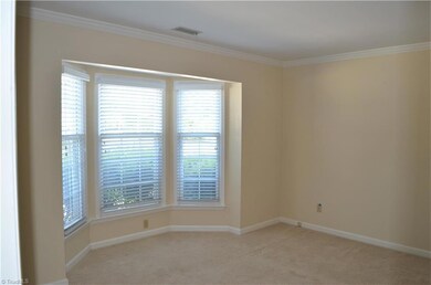 Bedroom on main level with bay window.