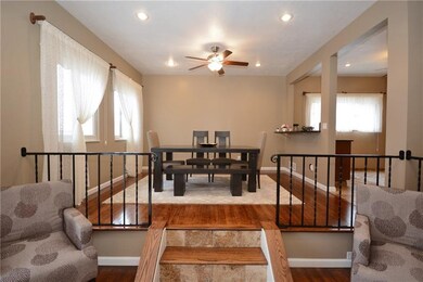 Steps off the living room lead up to the formal di