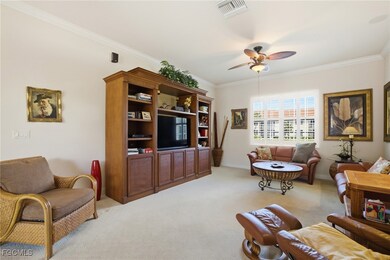 Great room with ceiling fans looking lakeview