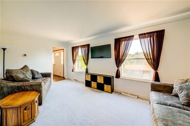 Living room freshly painted w/ crown molding and a