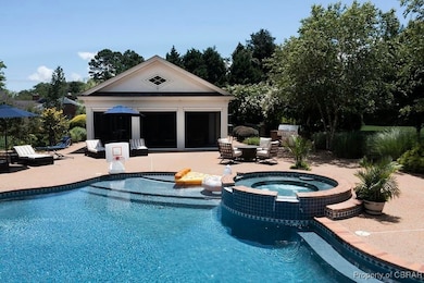 View of swimming pool with an outbuilding, a patio