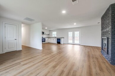 Unfurnished living room featuring light wood-type 