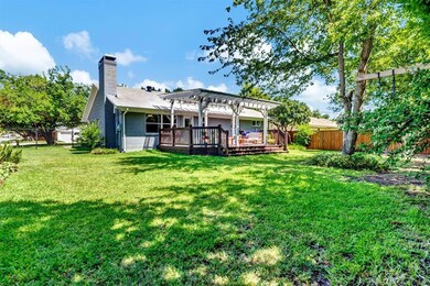 Oversized fully fenced backyard with mature trees 