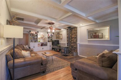 Living area with built-in bookcase/shelving and wo