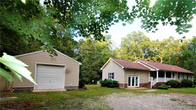 Front view of house and garage.