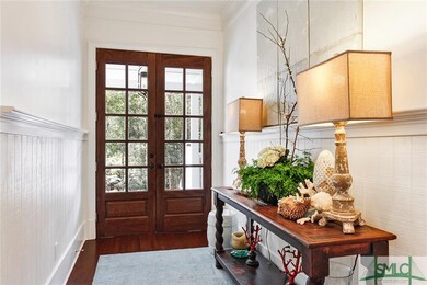 Foyer with double front  doors. Down the hall is a