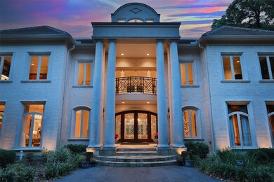 Built by Aaron Gabay Custom Homes, this gorgeous three-story home features over 11,662 square feet of pure elegance and timeless architectural detail throughout. The two story portico is framed by six doric columns faming the double lead glass entry doors. 
