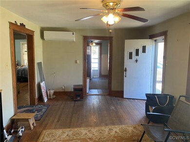 Foyer entrance featuring baseboards, ceiling fan,