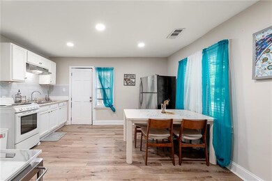 Kitchen with visible vents, light wood-style floor