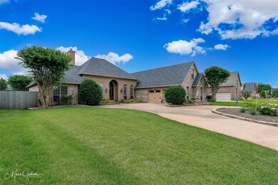View of front of home featuring a garage and a fro
