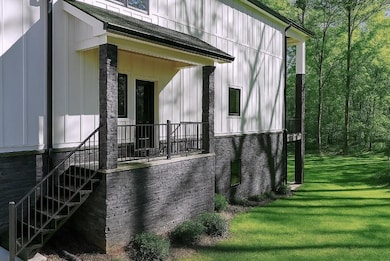View of property exterior with a lawn