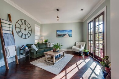 Enjoy this formal living room with french doors that lead to a beautiful covered patio.