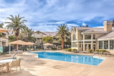 Pool with a patio and fence