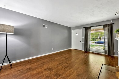 Wood laminate flooring throughout living and dinin