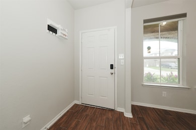 This entryway features a white front door with a s