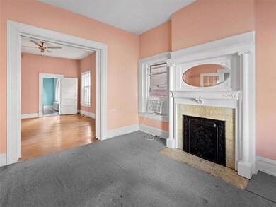 The first room off the front hallway is a formal l