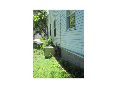 Side Yard. Also shows the newer air conditioner an