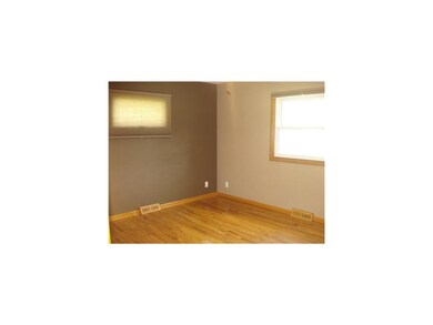 Bedroom. ALL THREE BEDROOMS HAVE HARDWOOD FLOORS A