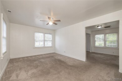 Unfurnished room with carpet floors and ceiling fa