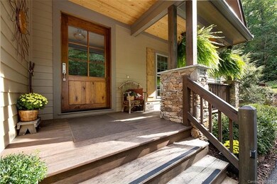 Front entry with stone columns and oversized custo