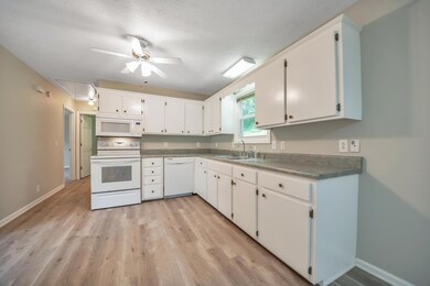 Spacious Kitchen with a lot of counter space. Window over the kitchen sink to look out huge backyard.