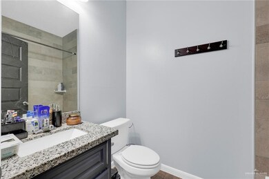Full bath with vanity and tiled shower