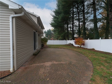 Fenced backyard with a patio area