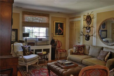 Living room is spacious yet cozy. Large window over looks courtyard and lets in beautiful natural light.