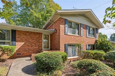 Step up to the front porch landing that has a space for seasonal plantings.