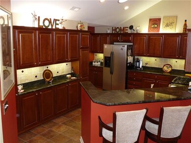 A gorgeous gourmet kitchen with seamless granite c
