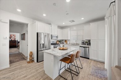 Kitchen featuring stainless steel appliances, a si