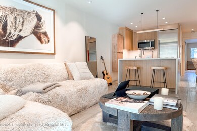 Living room interior facing kitchen