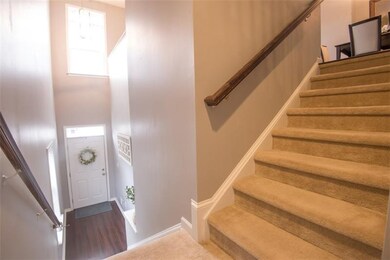 Walk into the large light filled two story entry.