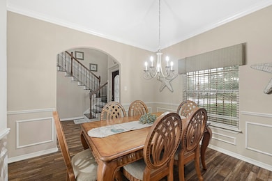 Formal dining area with elegant trim work and natu