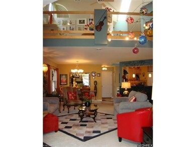 View from Sun Room to Living Room and upstairs ope