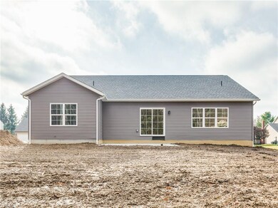 Private backyard with trees behind. patio