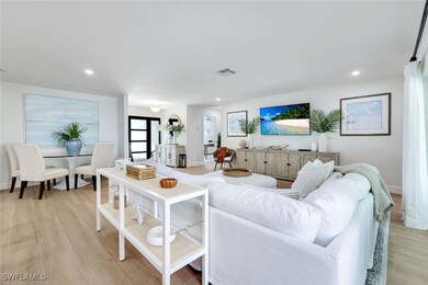 Living area with baseboards, recessed lighting, vi