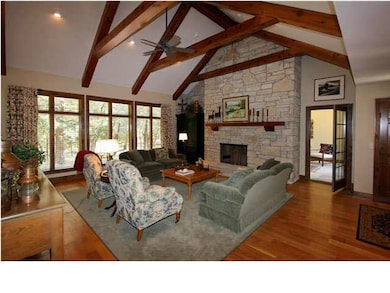 Grand wood beam ceiling accent the height of this 