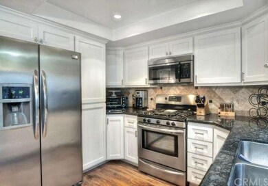 GRANITE COUNTERS AND TUMBLE STONE BACK SPLASH