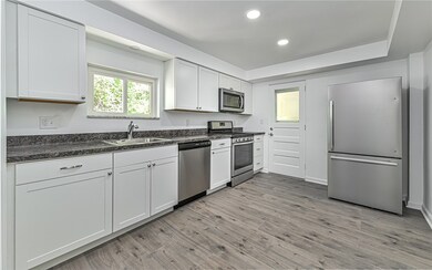 Brand new white cabinetry and countertops in kitch