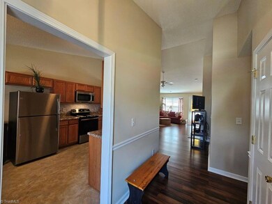 Entry view toward kitchen and living