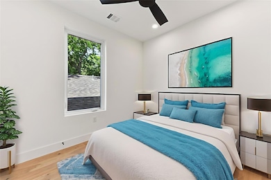 Bedroom with light wood-style flooring, baseboard
