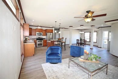 View of kitchen, living and dining. Nice breakfast