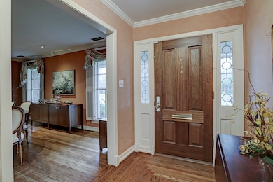A right turn from the entry leads into what was originally intended as a formal living room, but later used as a formal dining room.