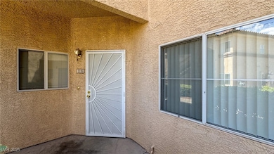 Doorway to property with stucco siding
