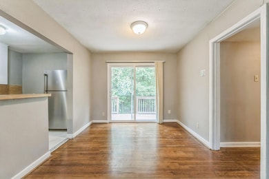 Unfurnished dining area with wood finished floors
