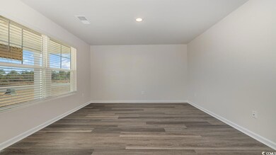 Unfurnished room with dark hardwood / wood-style f