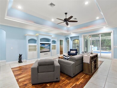 Living room with built in TV and shelves
