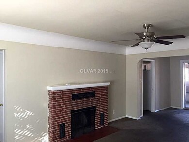 Living Room. original brick fireplace, coffered ce